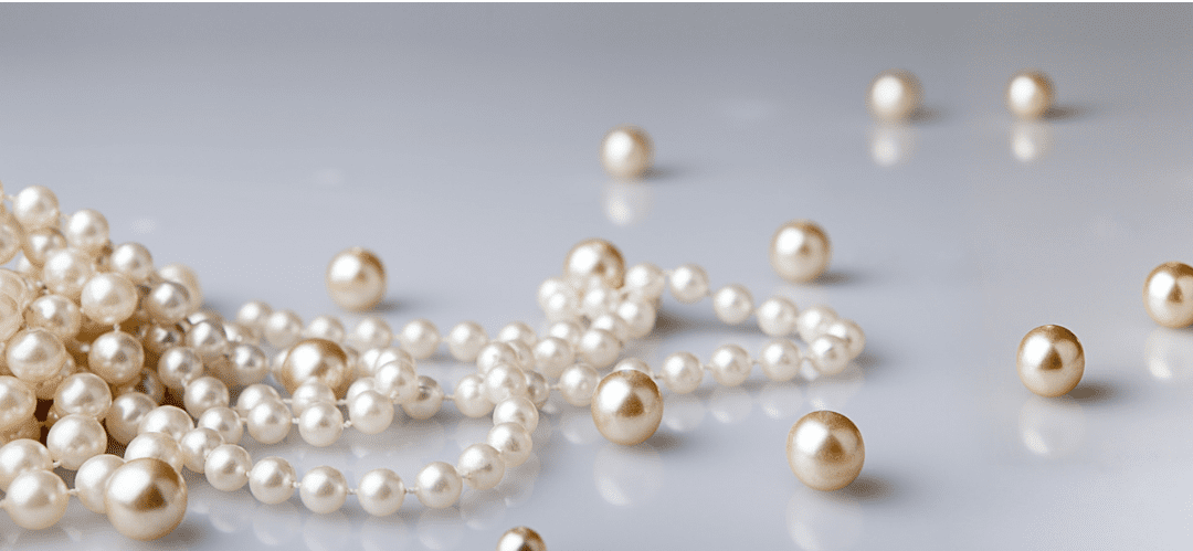 Pearls and beads knotted and restrung, strand by strand.